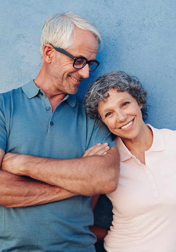 Older Smiling Couple After Dental Implants Procedure